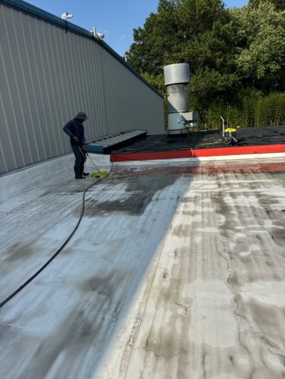 Pro Commercial Cleaning Team Working on a Roof in Burlington County NJ